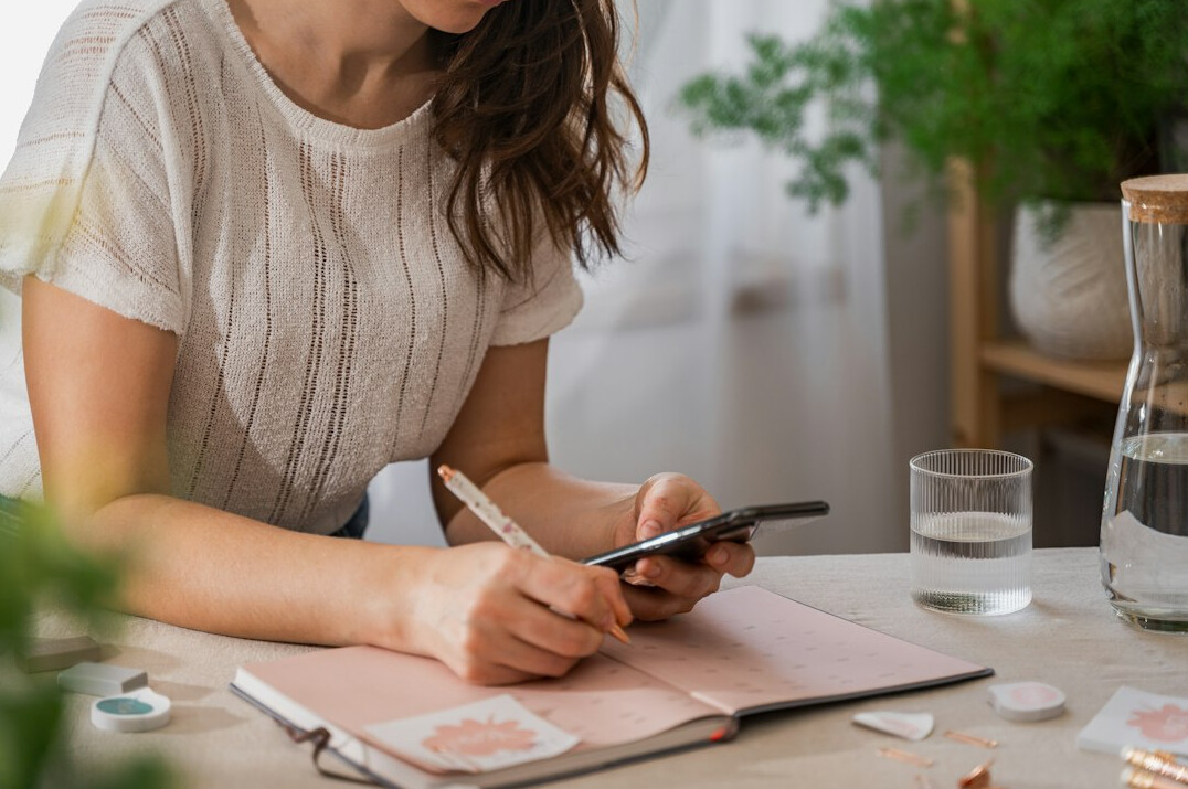 person planning budget on paper