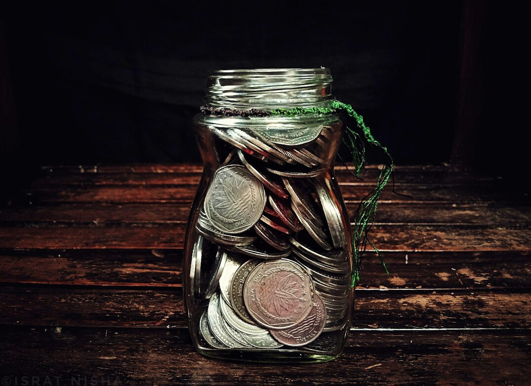 savings jar with coins