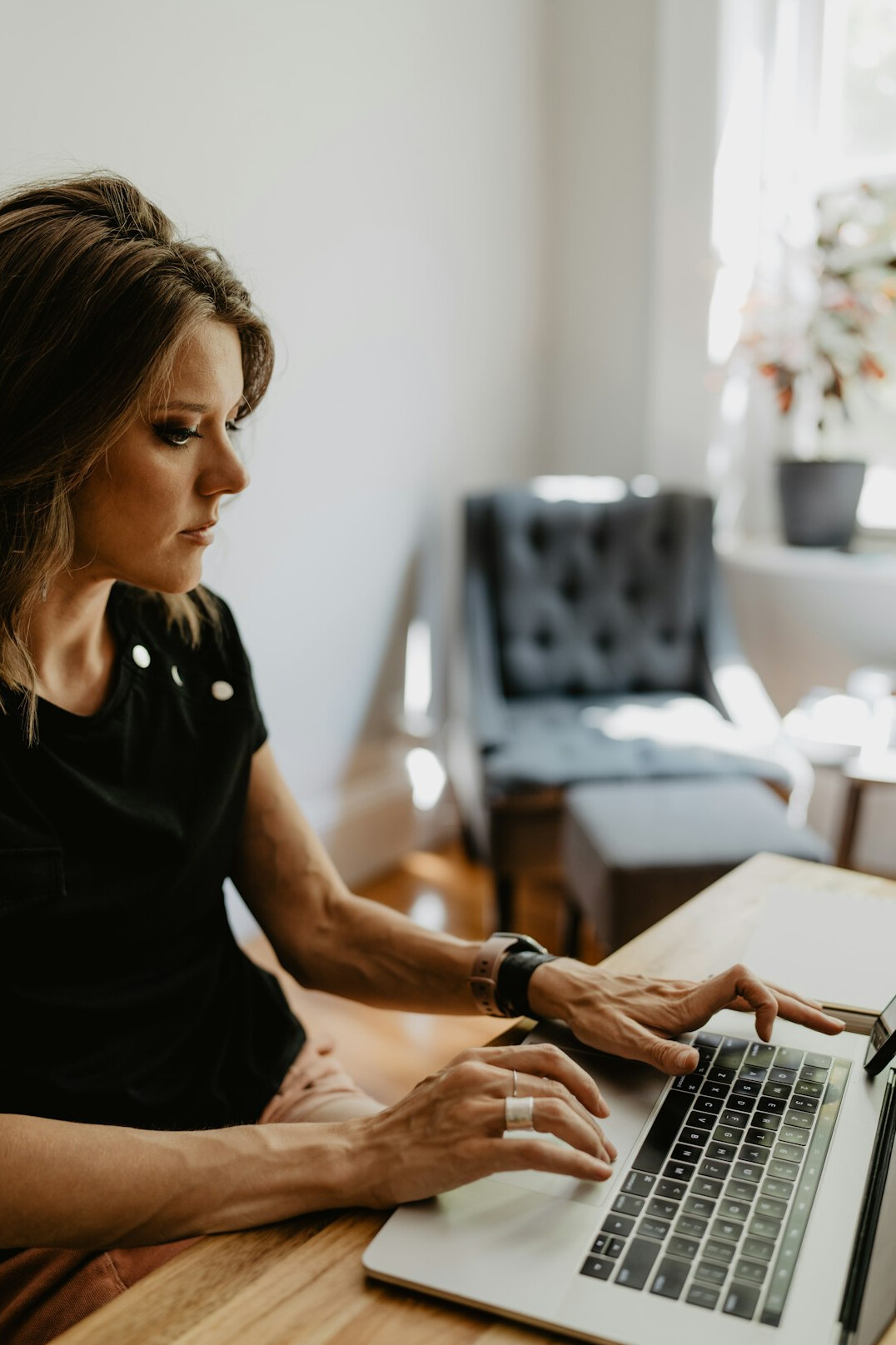 woman checking finances on laptop