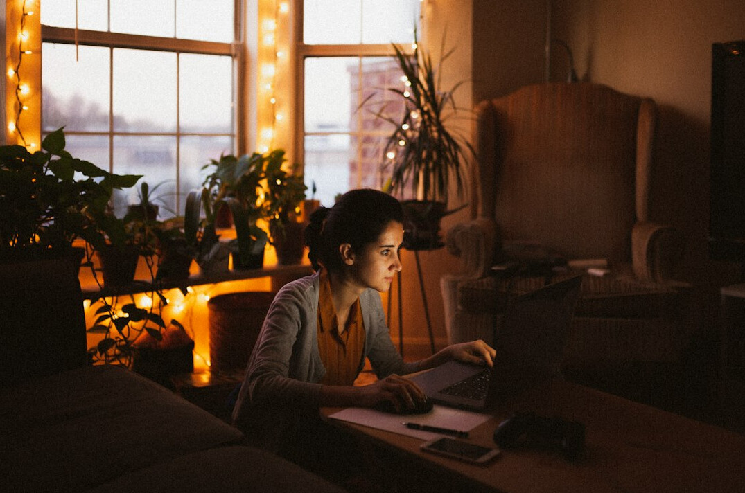 person reviewing debt papers at home