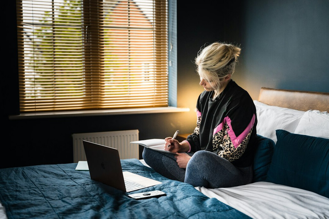 woman calculating budget on laptop
